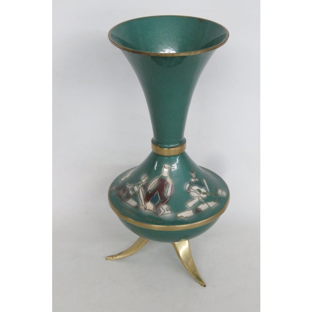 This gorgeous Tripod Vase is made of enameled brass. This piece has a classically vintage Mid Century style; it presents a...