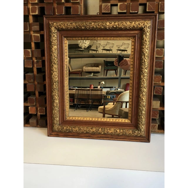 Early 20th century antique partial giltwood and gesso frame with new mirror. Wear consistent with age and use.