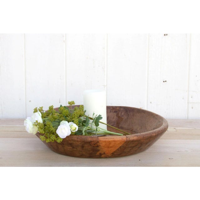 Skillfully hand-carved from exotic teak wood creating wonderful layers of texture and patina. This rustic bowl was...