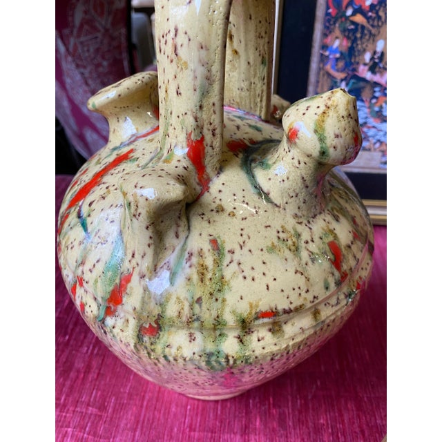 A beautiful vase with colorful splatter art, perfect for the interior designer or the enthusiast!