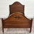 This is a gorgeous antique Victorian carved walnut full size bed. Features an elegant arched headboard and footboard, rich...