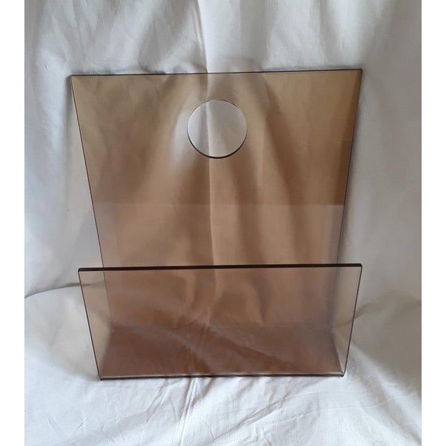 Vintage Wall-Hanging Newspaper Stand in Brown Tinted Acrylic Glass, 1970s, in Very Good conditions. Designed 1970 to 1979