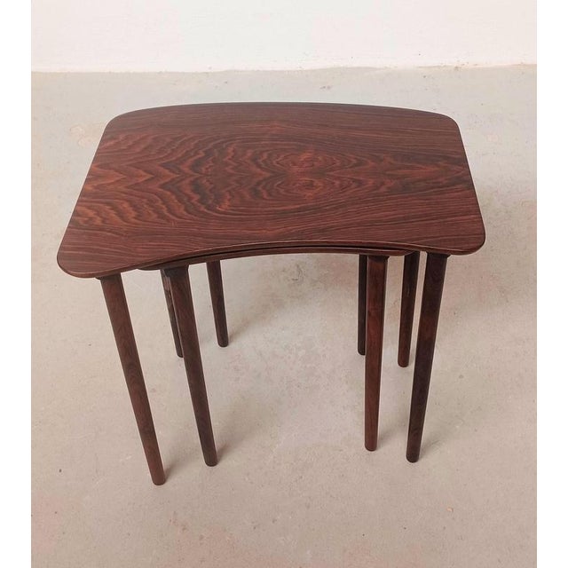 Set of two fully restored Danish rosewood nesting tables Rosewood mid-century bean shaped nesting tables made in a rich...