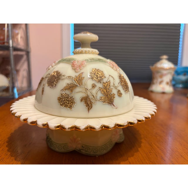 Custard Glass table set in "Chrysanthemum Sprig" pattern by Northwood Glass Company, includes covered butter dish, covered...