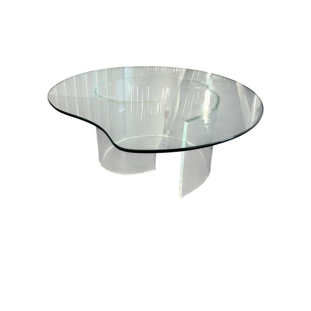Lucite Snail glass coffee table. The base of the table is made of lucite in the shape of a snail. Removable beveled glass...