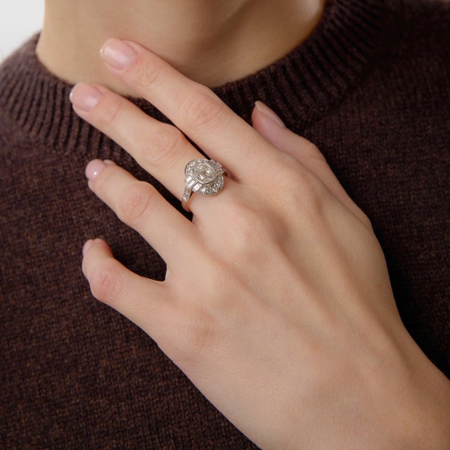 This modern engagement ring showcases the enduring romance of an old mine cut diamond within a refined contemporary...