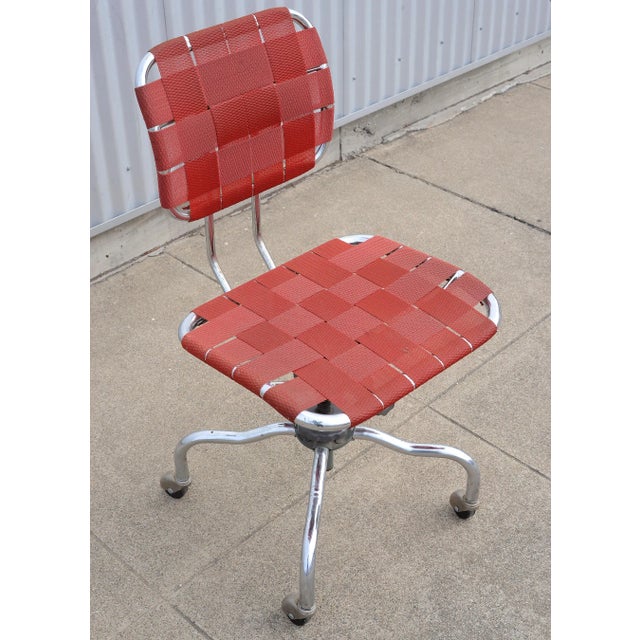 Extremely rare 1950s chrome office/desk chair on casters made by Bevco with red woven polyurethane seat and back. There...