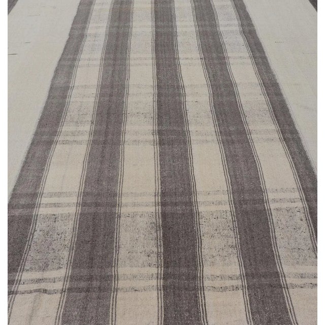 Flat-weave Kilim vintage rug from Turkey with stripes in gray, white, taupe, and cream. Keivan Woven Arts / Rug country of...
