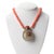 Natural coral bead necklace with a Chinese shadow agate snuff bottle pendant with coral stopper. The bottle stopper has...