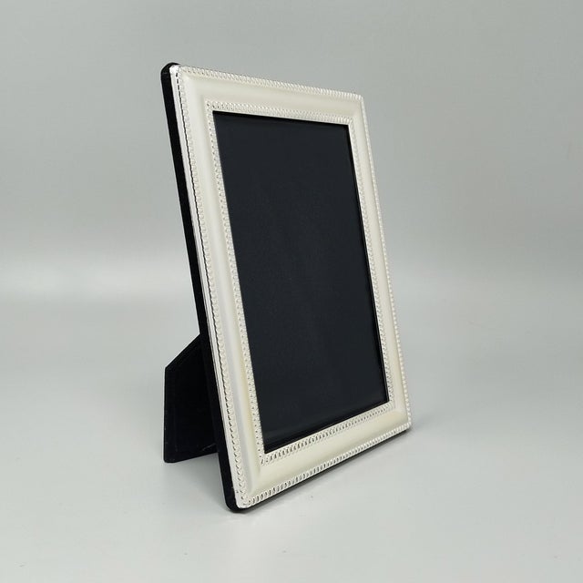 1970s Italian photo frame with glass. This frame is a superb example of the sleek, luxurious Modernist design language...