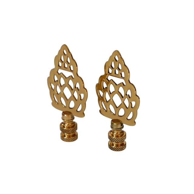 A pair of brass pineapple lamp finials. Fits a standard size lamp harp. Dimensions per finial. We have more lamp finials...