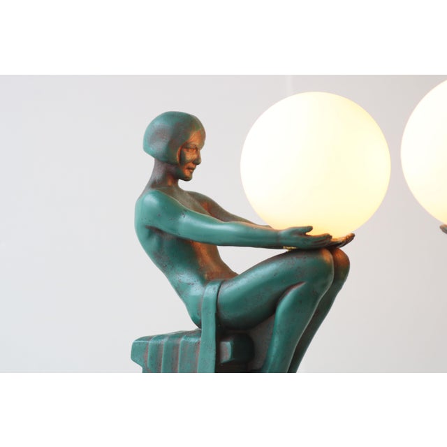A striking pair of Art Deco table lamps by French sculptor Max Le Verrier, dating from circa 1930. Model: ''Délassement...