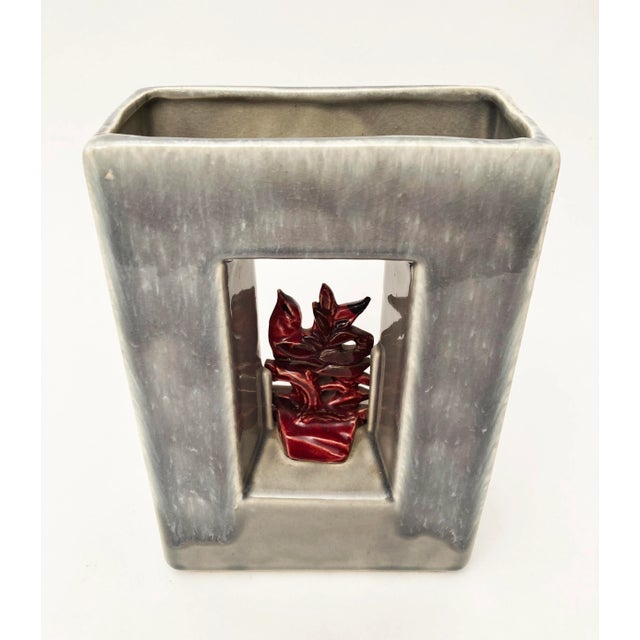 True to form for McCoy, this 1950's arcature or picture frame vase portrays a whimsical scarlet red bird on a branch. This...