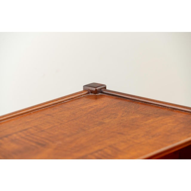 Pair of rectangular bedside tables with a single drawer at the waist and a crescent-shaped frame, crafted from walnut...