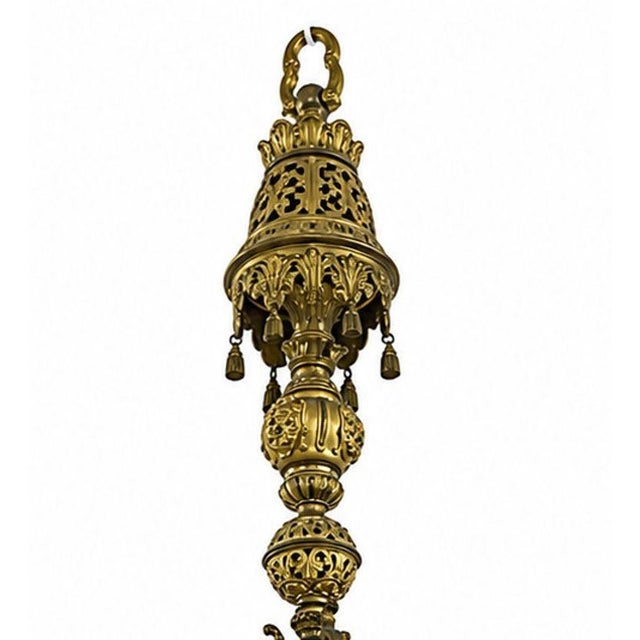An exceptional 19th century French chandelier crafted in richly detailed gilt bronze with an elegant gold-plated finish....