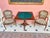 Elegant pair of armchairs in the Rococo style with hand-woven tapestry upholstery with floral motifs and a scene with...