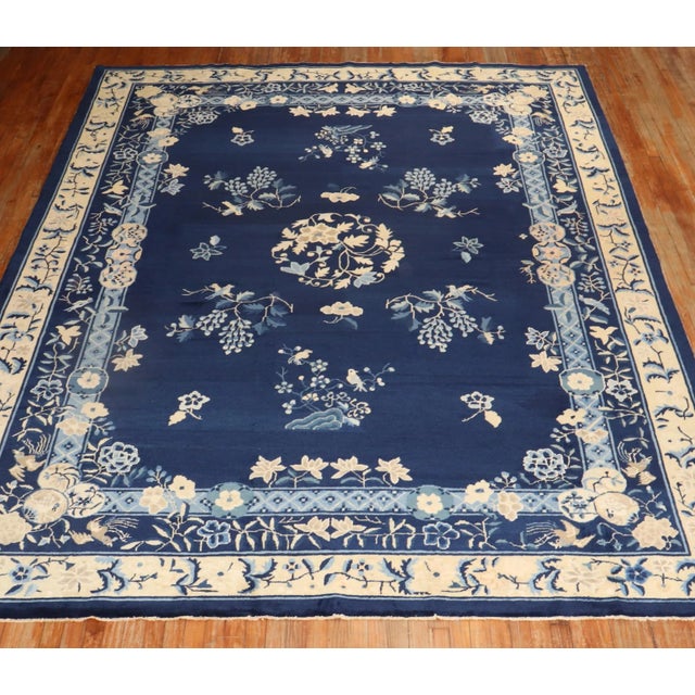 an early 20th Century Chinese Navy field beige and light blue accent room size floral rug Details rug no. j2578 size 8'...