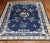 an early 20th Century Chinese Navy field beige and light blue accent room size floral rug Details rug no. j2578 size 8'...