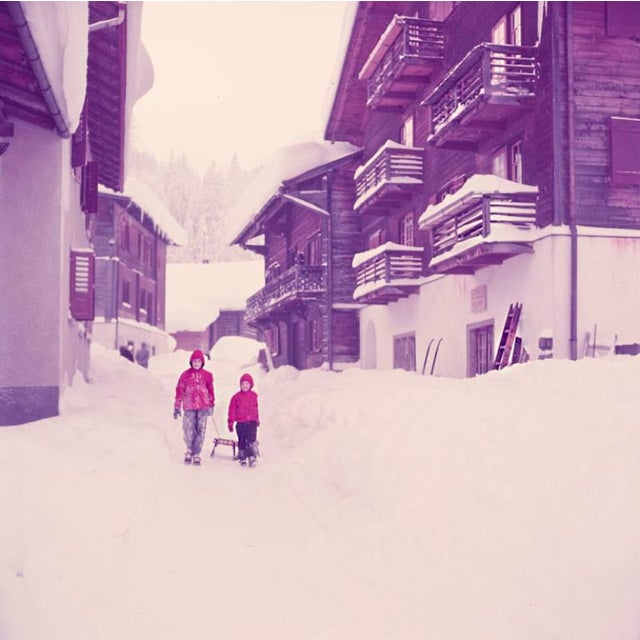 Sledging Trip 1951 Two children drag their sledge through the streets, Klosters, Switzerland, 1951. Toni Frissell...