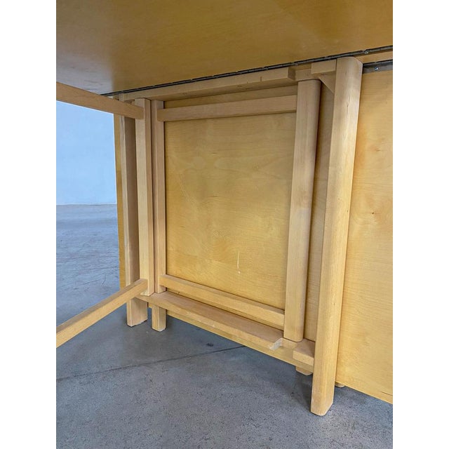 Maria Flap Folding Dining Table by Bruno Mathsso Width: from 25 to 278 cm Depth: 90cm Height: 74 cm. This piece has an...