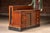 Substantial oak display counter featuring a glass-front upper showcase set atop a marble base, with a working counter-...