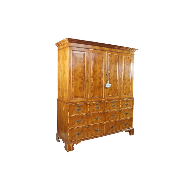 This George II period style cabinet-on-chest, linen press, wardrobe or armoire features exquisite yew wood and oyster burl...