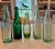 Vintage group of five soda and other collectible beverage bottles in various shades of green lighten up and bring...