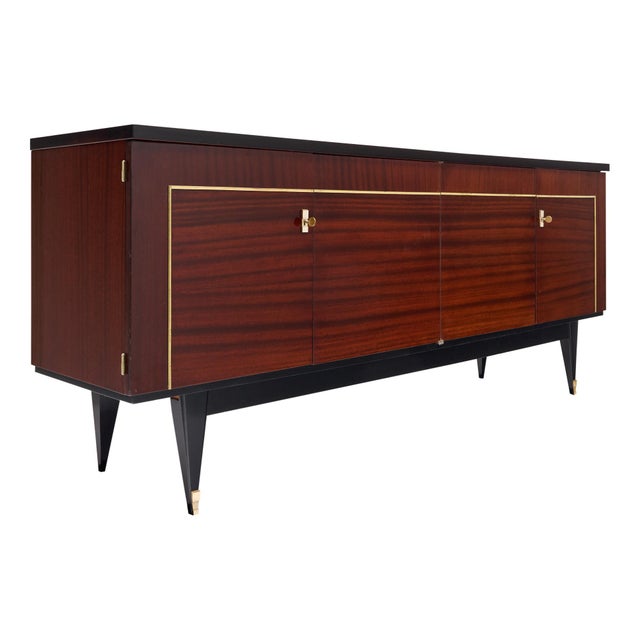 Vintage buffet from France made with a rosewood façade and ebonized detailing on the tapered legs and base. Four doors...
