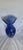 Gorgeous cobalt blue art glass valse decorated with vibrant multi-colored millefiori inclusions and elegant swirling...