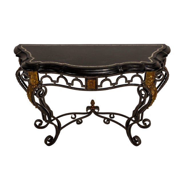 Elegant Maitland-Smith console table crafted with a tessellated marble top and an intricately detailed wrought iron base...