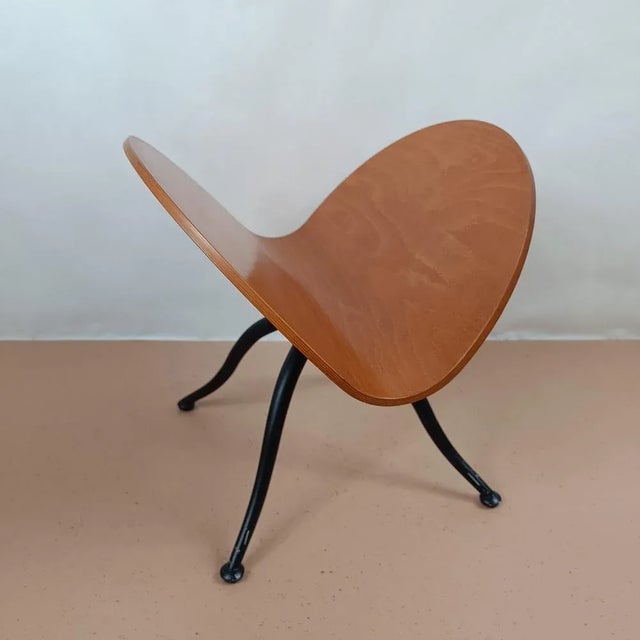 Elegant magazine rack by the Italian design brand Calligaris. The magazine rack features a black, spray-painted aluminum...