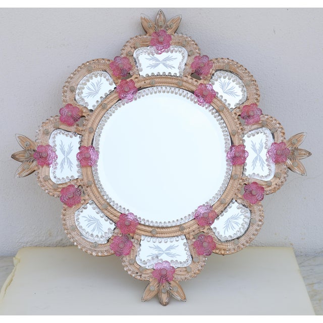 Elegant Murano glass mirror from the 1960s, showcasing refined Italian craftsmanship and a delicate palette of soft pink...