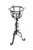 This vintage wrought iron plant stand showcases a classic, hand-forged gothic or brutalist design characterized by a...