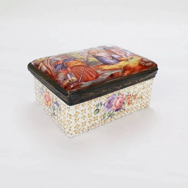 A fine and rare antique 18th century South Staffordshire or Battersea enamel table snuff box. The lid has a scene of two...