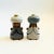 A pair of mid century pottery salt and pepper shakers in the shape of a king and a queen. Wonderful detailing throughout....