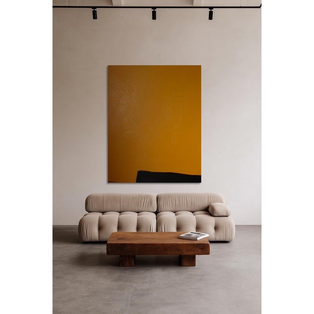 Bring timeless serenity to your home with this unique abstract painting. Hand-painted in rich ochre and deep black, *MB 2*...