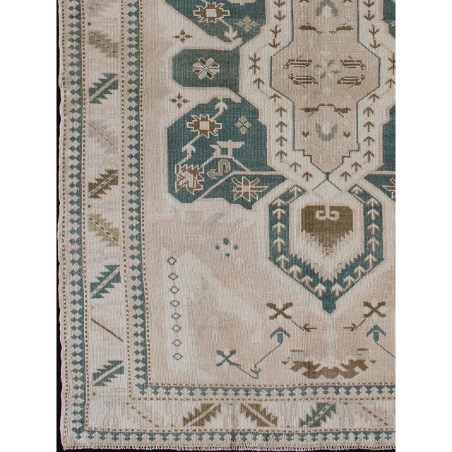 Measures: 4'9 x 7'2 Vintage Turkish Oushak Rug Featuring Soft Ivory Field with Green 4'9 x 7'2. Keivan Woven Arts / Rug...