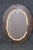 Gold Pair of Beveled Glass Oval Neoclassical Style Gilded Mirrors For Sale - Image 8 of 9