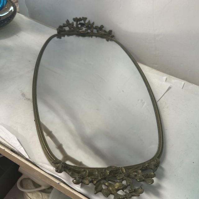 Beautiful mirror vanity tray with handles consisting of a bird and flowers. Great detail that would add elegance to any...