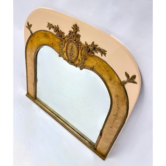 Large antique floral and ribbon Edwardian style vanity mirror with trumpet vase, floral, and leaf accents. No maker's...