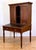 Federal style postmaster's secretary desk made of dark stained walnut. The top section features a double cabinet with two...