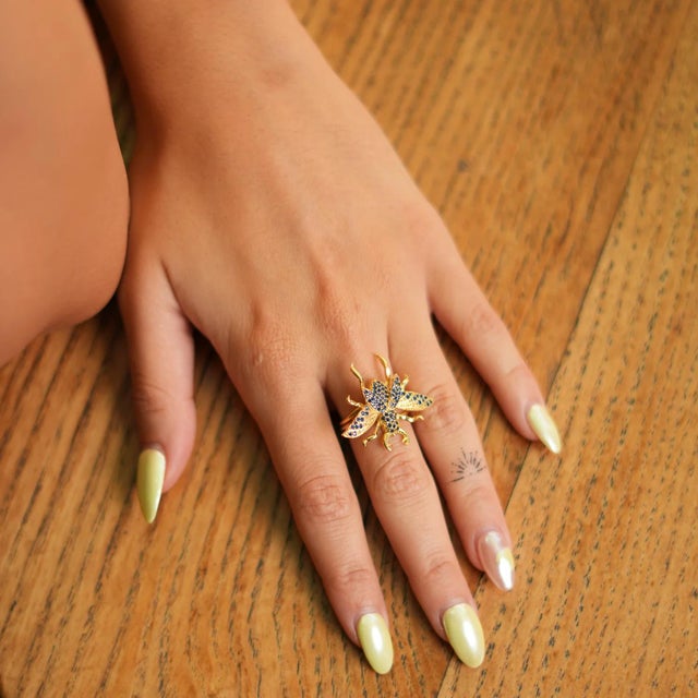 Queen Bee Sapphire & Gold Chunky Ring, a bold and regal piece designed to bring luck and power. Featuring 24k gold plating...