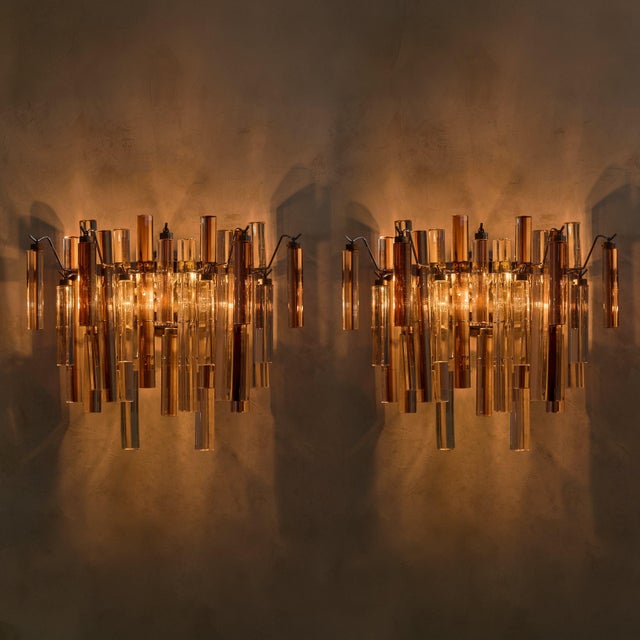 Hand-worked Murano glass defines this pair of Italian sconces from the 1960s, attributed to Venini, each element shaped...