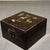 Charming square hardwood treasure box, hand-decorated with mother-of-pearl shell inlay on the lid. The artwork depicts the...