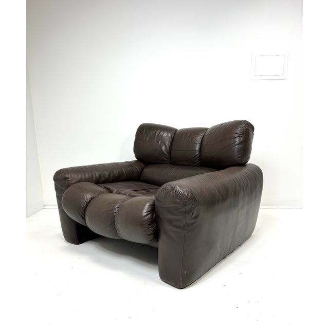 !970's Leather lounge chair designed by Tongiana Stefano chair. Original dark brown leather.