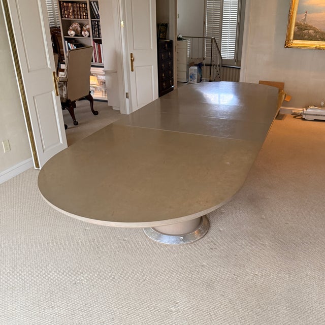 Post-Modern Expandable Dining Table A racetrack shaped table with two pillar pedestals. Finish is a pickled burl—unique...