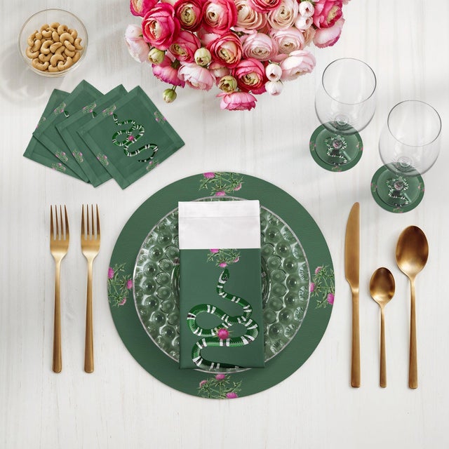 Infuse your dining space with classical elegance and whimsy through the Thistle And Snake Vegan Leather Round Pebble...