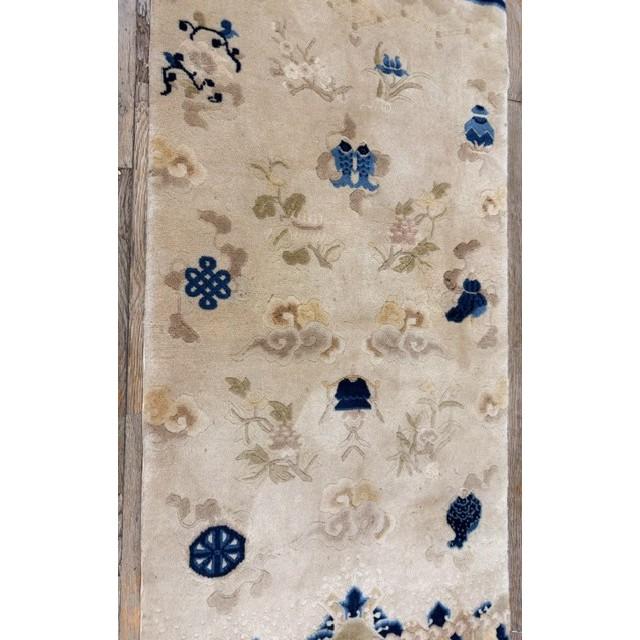 "This is an exceptionally rare and charming small antique Chinese Peking accent rug, Handcrafted circa 1920, this true...