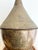 This large brass Moroccan lidded vessel, resembling a tagine, showcases authentic craftsmanship and cultural charm....