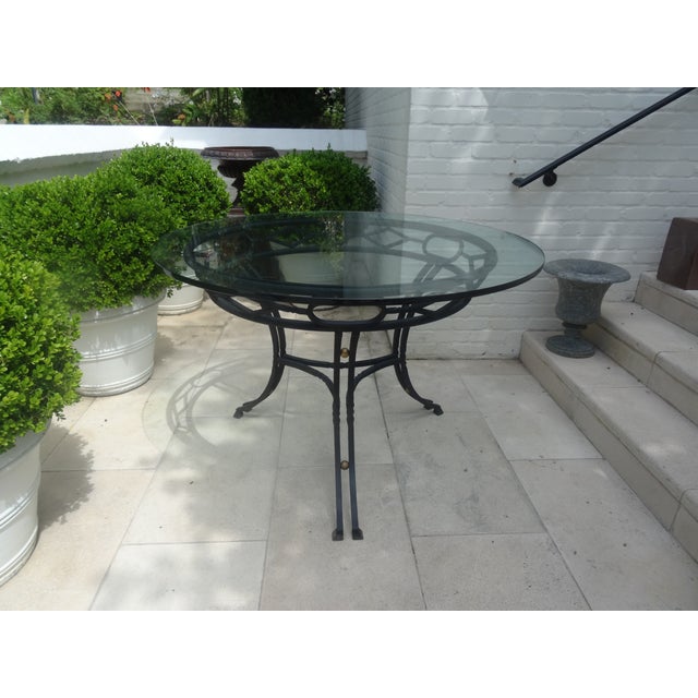 Impressive hand wrot Iron center table that was a bespoke piece from Murry's Iron Works Los Angeles. A source for the...